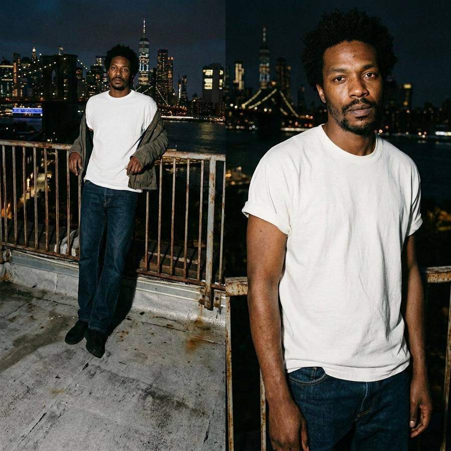 AI-generated night photograph of two friends in white t-shirts against a city skyline