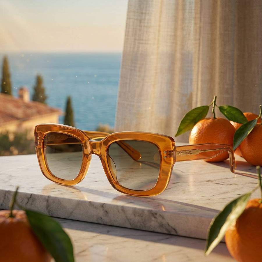 AI product photography: amber sunglasses on marble with oranges and a sea view