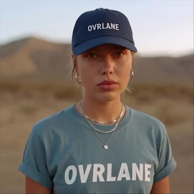 AI video: a woman in a navy cap and teal t-shirt in the desert
